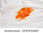 Dirty tomato sauce stain or ketchup on cloth to wash with washing powder, cleaning housework.