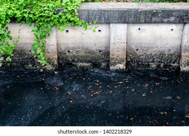 Dirty Waste Dark Black Stink Bad Water Smell From City Under Water Pollution Process Sewer Drain Pipe Dirt Sewage Water Drain To Wastewater Treatment With Poor Ecosystem And Circular Economy. 