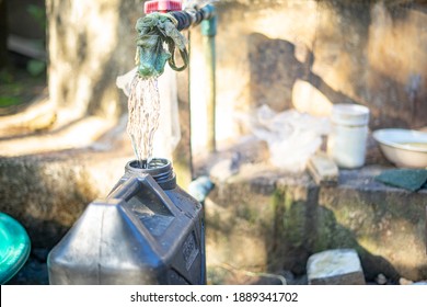 Dirty Water Coming Out Of Faucet For Poor Cummunity To Drink