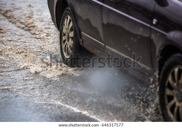 dirty water splash\
after vehicle roaring by