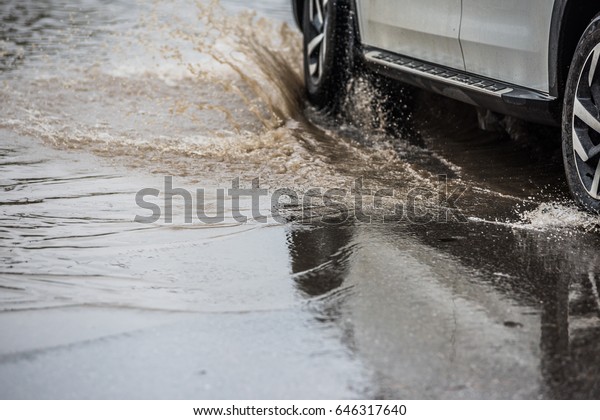 dirty water splash\
after vehicle roaring by