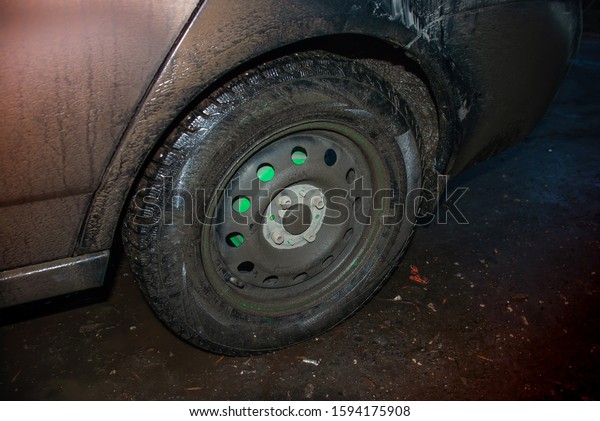 dirty wheel on a dirty\
car