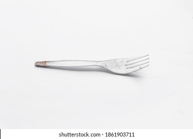 Dirty White Plastic Fork On White Background
