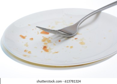 Dirty White Plate On White Background And Fork Isolated