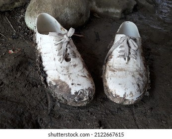 Dirty White Shoes Because It Just Rained And The Road Is Very Muddy