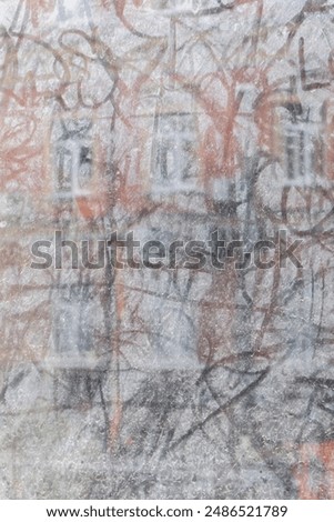 Dirty window with reflection of building in front. Dusty window of abandoned building. Street art on glass concept. Urban lifestyle. Drawing on dirty old window. Vintage background. 