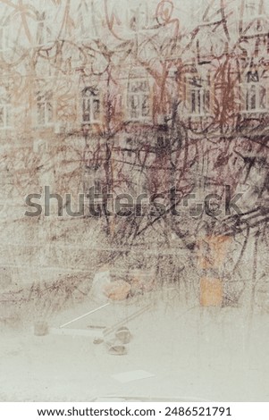 Dirty window with reflection of building in front. Dusty window of abandoned building. Street art on glass concept. Urban lifestyle. Drawing on dirty old window. Vintage background. 