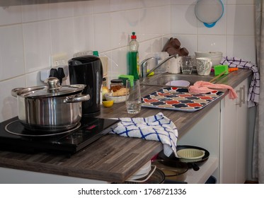 A Dirty Wooden Kitchen Counter After A Night Of Cooking.