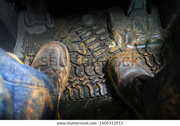 Dirty work boots inside\
pick up car