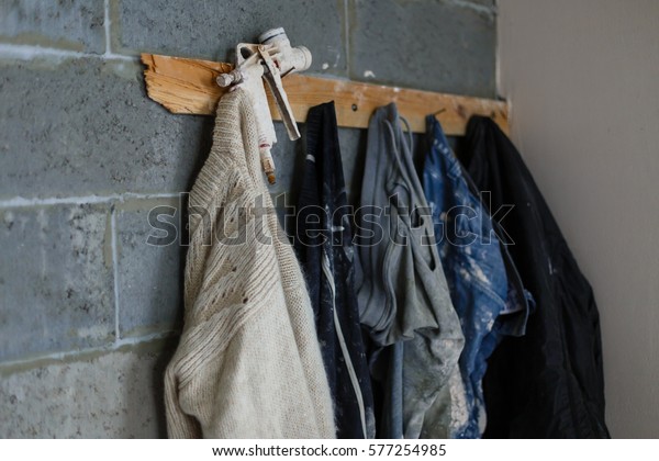 Dirty Work Clothes Hanging On Wooden Stock Photo Edit Now 577254985