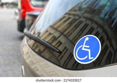 Disability car sticker. Sticker on a car. Sign of a person with a disability. Wheelchair symbol.