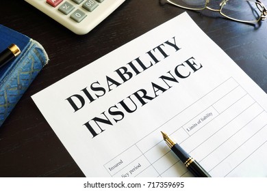 Disability Insurance On A Table.
