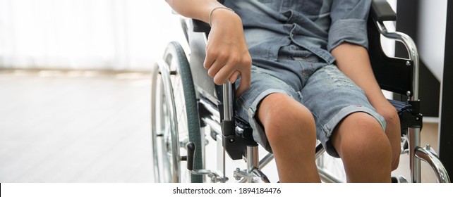Disability polio patient sitting on wheelchair in hospital, Banner with copy space - Shutterstock ID 1894184476