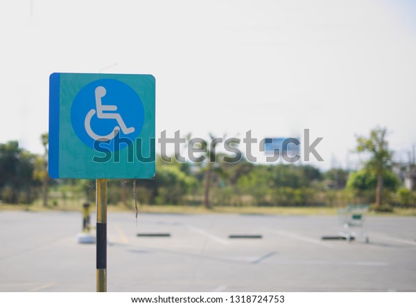 The\
disability priority sign on the parking\
lot