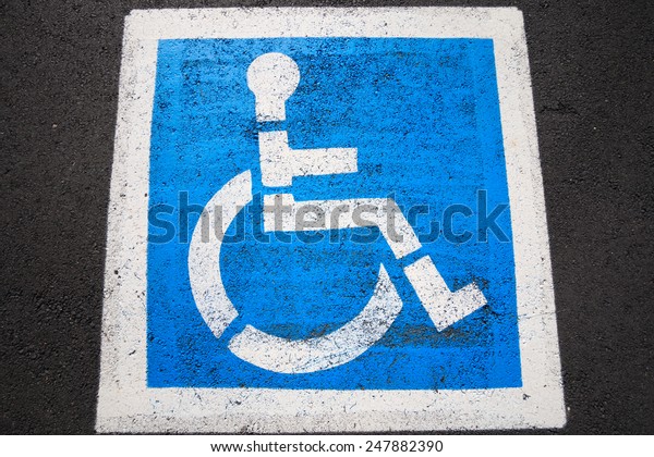 Disability sign on the road\
background