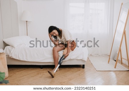 disability woman prosthetic leg user feeling stress sad crying at home bedroom alone mental problem suffer pain