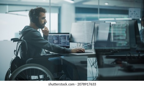 Disability-Friendly Office: Brilliant IT Programmer with Disability in a Wheelchair Working on Desktop Computer. Male Specialist Create Inspirational Software. Engineer Develop Innovative App, Program - Shutterstock ID 2078917633
