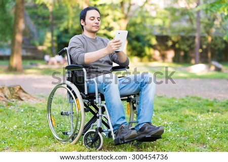 Disable man using a digital tablet 