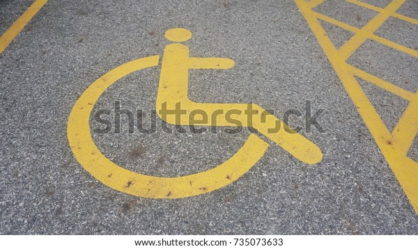 Disable people sign on\
floor / parking lot