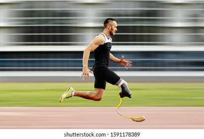 disabled athlete amputee leg running with prosthetic on background of motion blur - Powered by Shutterstock