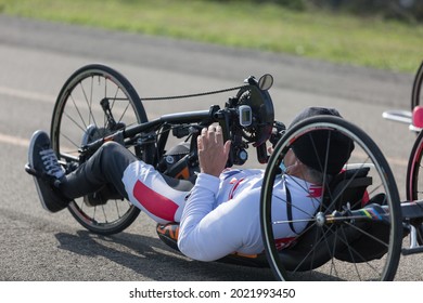 Disabled Athlete Training With His Hand Bike On A Track.