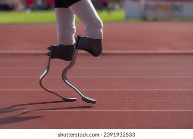 Disabled athletes with running blade used for short races on a running track. - Powered by Shutterstock