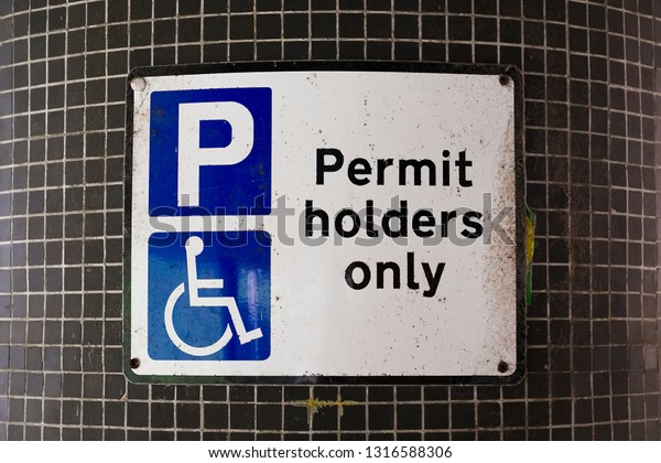 Disabled Badge\
Holders Only at Car Park Sign\
Post