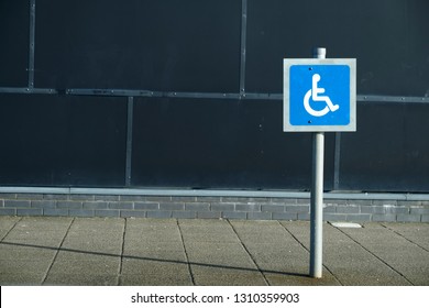 Disabled Blue Badge Holders Only At Car Park Sign Post