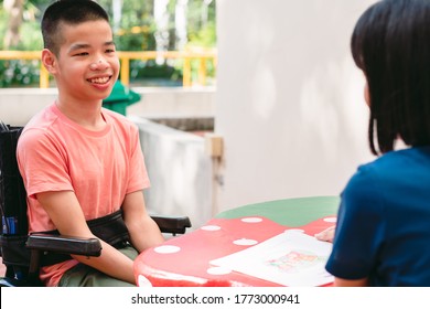 Disabled child on wheelchair happy time to home school and reading a book, Study and Work at home for safety from covid 19, Life in the education age of special need kid, Happy disability boy concept.