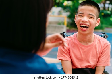 Disabled Child On Wheelchair Happy Time To Home School And Reading A Book, Study And Work At Home For Safety From Covid 19, Life In The Education Age Of Special Need Kid, Happy Disability Boy Concept.