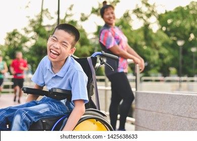 Disabled child on wheelchair is play and learn in the outdoor park like other people, Life in the education age of special children, Happy disability kid concept. - Shutterstock ID 1425638633