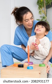 Disabled Child Is Playing, Learning And Exercising In Rehabilitation Therapy Hospital, Lifestyle Of A Child With Disability. Happy Disability Kid Concept .