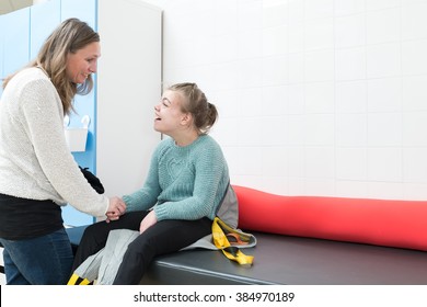 Disabled Child Together With A Special Needs Carer / Working With Disability