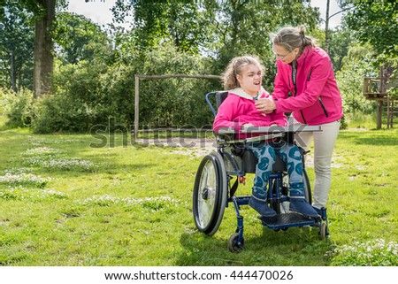 Similar – Granddaughter running to grandmother in wheelchair