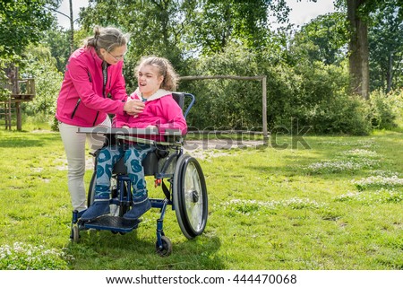 Similar – Granddaughter running to grandmother in wheelchair