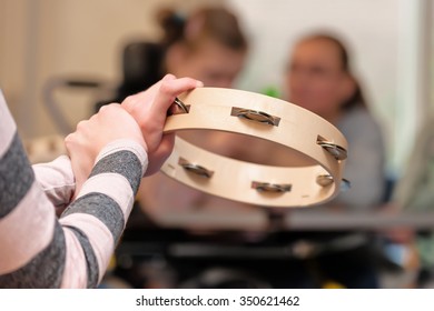  Disabled Children Having Music Therapy In A Group / Working With Mentally Handicapped People