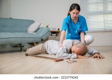 Disabled Elderly Old Man Patient With Walking Stick Fall On Floor And Caring Young Assistant At Nursing Home, Asian Older Senior Man Falling Down On Lying Floor And Woman Nurse Came To Help Support