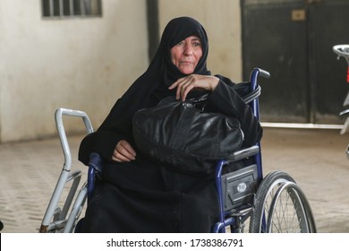A disabled elderly woman is waiting to enter the doctor's office in Azaz, Syria at 27 February 2020