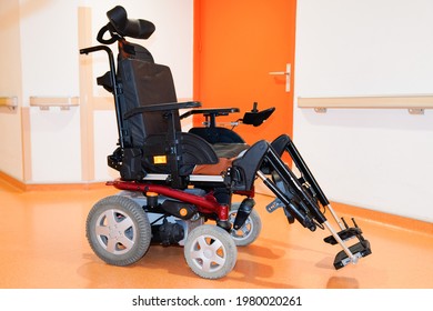disabled electric chair empty in corridor hospital wheelchair indoors