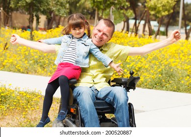 Disabled Father showing freedom with his little daughter.