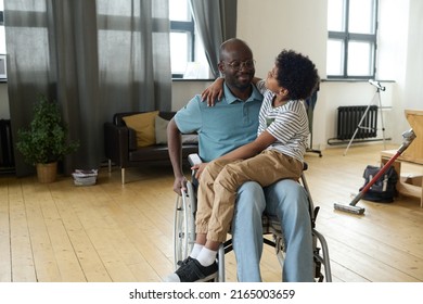 Disabled father spending time with son - Powered by Shutterstock