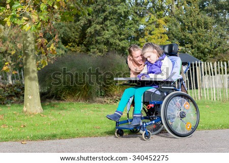 Similar – Granddaughter running to grandmother in wheelchair