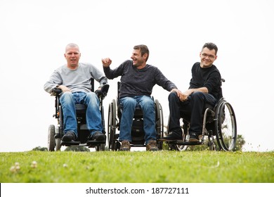 Disabled Happy friends having fun together outside.