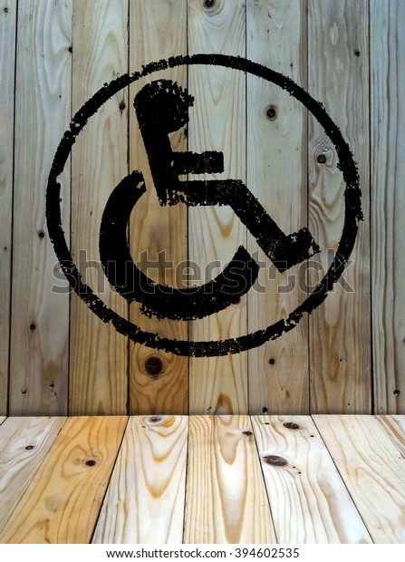 disabled icon sign,\
old wood wall\
background.