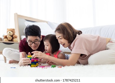 Disabled Kid And Father, Mother Is Playing Together With Fun, Colorful Wooden Toys That Can Increase Skills And Learning To Increase The Development Of Children With Learning Disabilities, Know Slowly