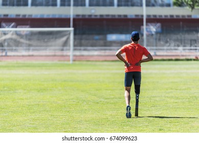 Disabled man athlete training with leg prosthesis. Paralympic Sport Concept. - Powered by Shutterstock