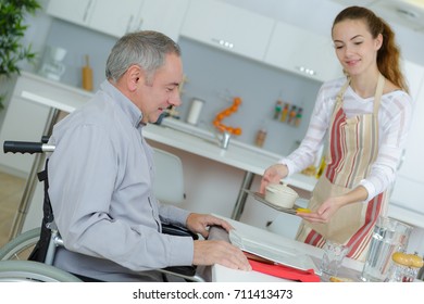 disabled man having breakfast