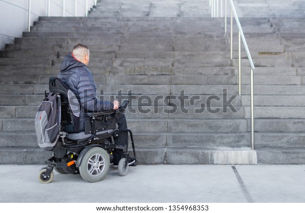 Disabled Man On Electric Wheelchair Who Stock Photo Edit Now 1354968353