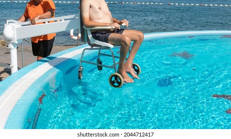Disabled Man On Pool Wheelchair Lift Stock Photo 2044712417 | Shutterstock