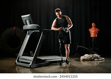 A disabled man with a prosthetic leg stands on a treadmill in a dark room, persevering through his workout. - Powered by Shutterstock